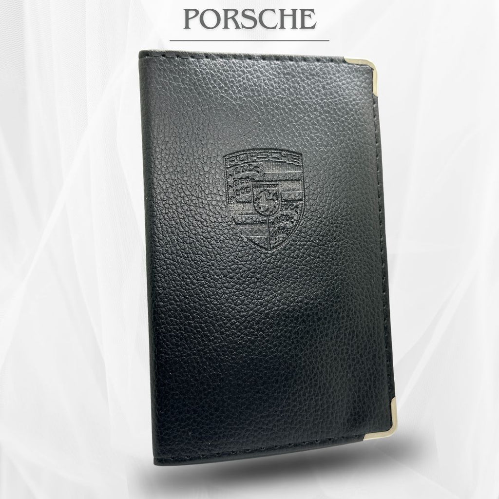 Porte carte grise de couleur noir avec le logo porsche
