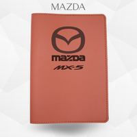 Port document Mazda MX-5 de couleur marron