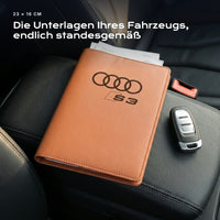 Fahrzeugmappe Audi S3 auf einem Autositz, mit Rechnungen