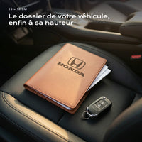 Porte-documents HONDA posé sur un siège, avec des factures