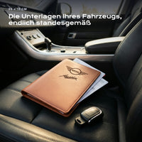 Fahrzeugmappe Mini Cooper Austin auf einem Autositz, mit Rechnungen