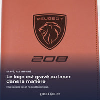 Logo Peugeot 208 gravé au laser dans le simili cuir