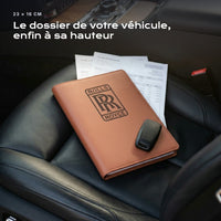 Porte-documents ROLLS-ROYCE posé sur un siège, avec des factures