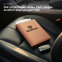 Fahrzeugmappe SCANIA auf einem Autositz, mit Rechnungen